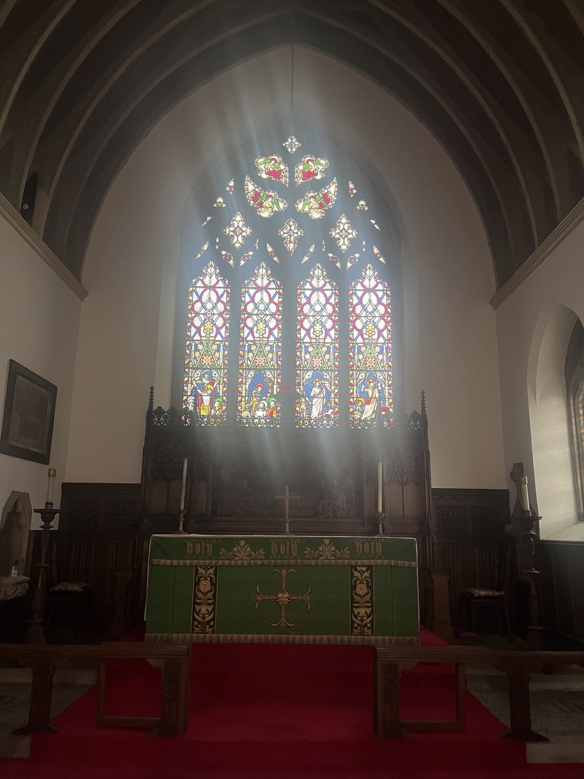 The church altar and stained glass window
